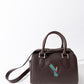 Kinti - Cartera bordada Landa Brands